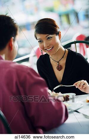 Couple having lunch at restaurant View Large Photo Image Stock Photograph - Couple having lunch at restaurant. Fotosearch