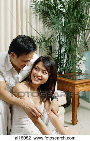 Couple in living room View Large Photo Image Stock Image - Couple in living room. Fotosearch