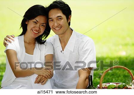 Couple in park, smiling at camera View Large Photo Image Stock Image - Couple in park, smiling at camera. Fotosearch
