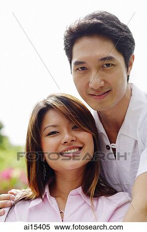 Stock Photography - Couple looking at camera, portrait. Fotosearch