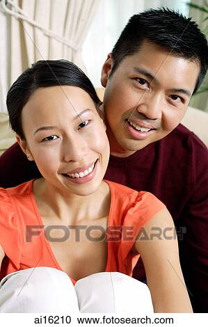 Stock Image - Couple looking at camera. Fotosearch