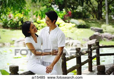 Couple looking at each other, embracing View Large Photo Image Stock Photography - Couple looking at each other, embracing. Fotosearch