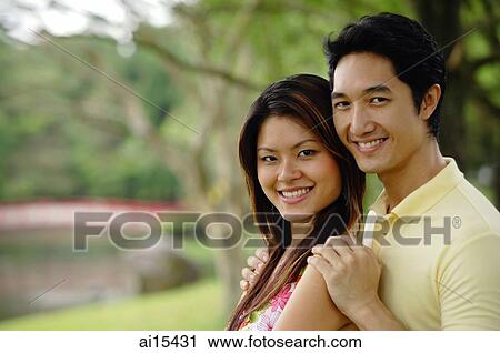 Couple smiling at camera, portrait View Large Photo Image Stock Image - Couple smiling at camera, portrait. Fotosearch