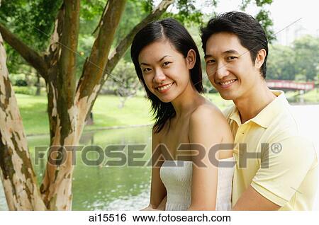 Couple smiling at camera View Large Photo Image Stock Photograph - Couple smiling at camera. Fotosearch