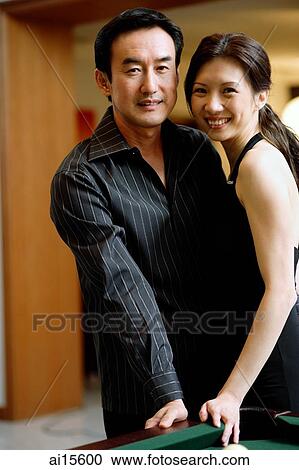 Couple standing cheek to cheek, smiling at camera View Large Photo Image Stock Image - Couple standing cheek to cheek, smiling at camera. Fotosearch