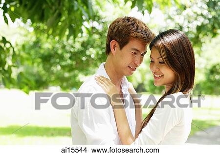 Couple standing face to face View Large Photo Image Picture - Couple standing face to face. Fotosearch