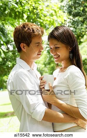 Couple standing face to face, portrait View Large Photo Image Stock Image - Couple standing face to face, portrait. Fotosearch