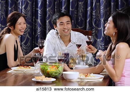 Couples having dinner at home View Large Photo Image Stock Image - Couples having dinner at home. Fotosearch