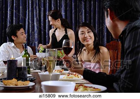 Couples having dinner at home View Large Photo Image Stock Photo - Couples having dinner at home. Fotosearch