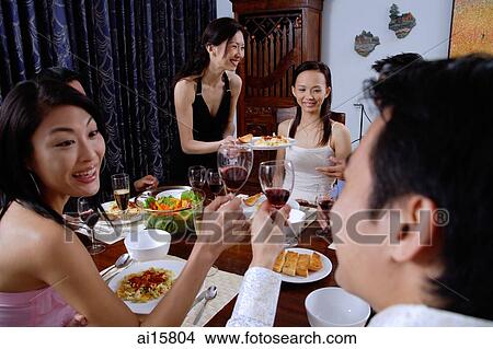 Couples having dinner party at home View Large Photo Image Picture - Couples having dinner party at home. Fotosearch