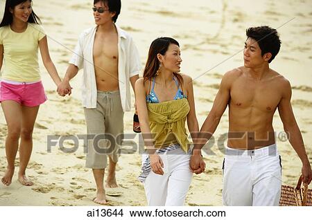 Picture - Couples holding hands and walking. Fotosearch