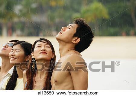 Couples standing, eyes closed, looking up View Large Photo Image Stock Image - Couples standing, eyes closed, looking up. Fotosearch
