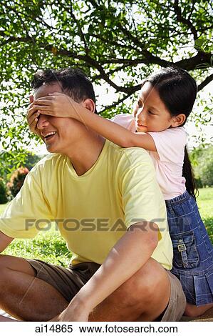 Daughter covering father's eyes with her hands View Large Photo Image Stock Photography - Daughter covering father's eyes with her hands. Fotosearch