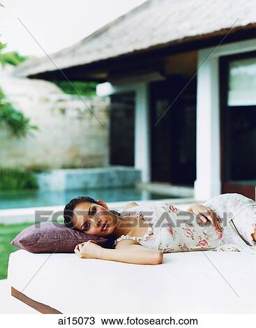 Eurasian female reclining on daybed View Large Photo Image Stock Image - Eurasian female reclining on daybed. Fotosearch