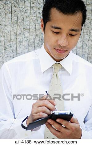 Stock Photo - Executive using PDA. Fotosearch