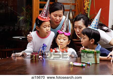 Family celebrating birthday, blowing candle View Large Photo Image Stock Image - Family celebrating birthday, blowing candle. Fotosearch