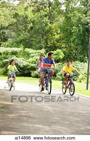 Family cycling, side by side View Large Photo Image Stock Photograph - Family cycling, side by side. Fotosearch