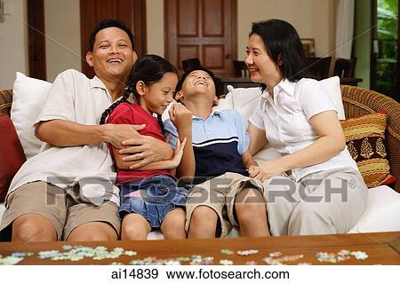 Family in living room, bonding, portrait View Large Photo Image Stock Photo - Family in living room, bonding, portrait. Fotosearch