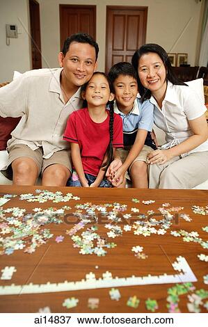 Family in living room, portrait View Large Photo Image Stock Photo - Family in living room, portrait. Fotosearch