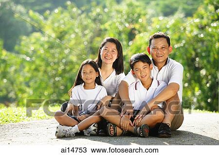 Family looking at camera, smiling View Large Photo Image Stock Image - Family looking at camera, smiling. Fotosearch