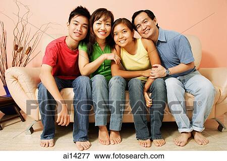 Family of four sitting side by side, looking at camera, portrait View Large Photo Image Stock Photo - Family of four sitting side by side, looking at camera, portrait. Fotosearch