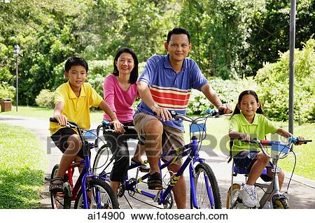 Family on bicycles, looking at camera View Large Photo Image Stock Image - Family on bicycles, looking at camera. Fotosearch