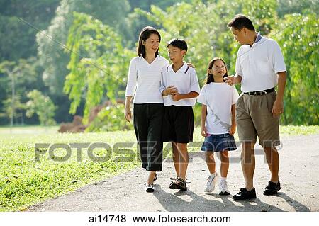 Family walking in park View Large Photo Image Stock Photo - Family walking in park. Fotosearch
