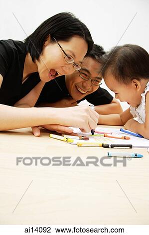 Family with one child drawing with crayons View Large Photo Image Stock Image - Family with one child drawing with crayons. Fotosearch