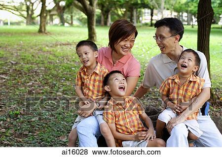 Family with three boys in park View Large Photo Image Stock Photo - Family with three boys in park. Fotosearch