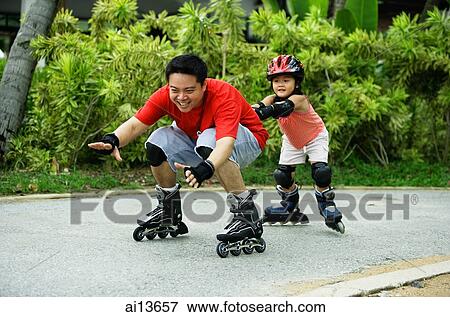 Father and daughter inline skating View Large Photo Image Stock Photo - Father and daughter inline skating. Fotosearch