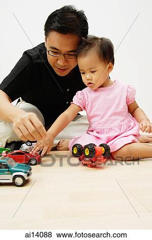 Father and daughter playing with cars View Large Photo Image Stock Photo - Father and daughter playing with cars. Fotosearch