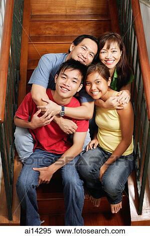 Father and mother sitting on stairs, hugging daughter and son, portrait View Large Photo Image Stock Photography - Father and mother sitting on stairs, hugging daughter and son, portrait. Fotosearch