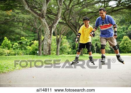 Father and son, in-line skating in park, holding hands View Large Photo Image Stock Image - Father and son, in-line skating in park, holding hands. Fotosearch