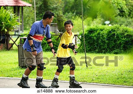 Father and son on roller blades View Large Photo Image Stock Photo - Father and son on roller blades. Fotosearch