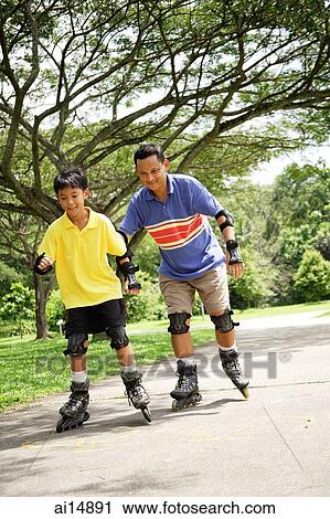 Father and son skating in park View Large Photo Image Stock Image - Father and son skating in park. Fotosearch