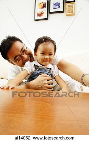 Father holding young daughter View Large Photo Image Stock Image - Father holding young daughter. Fotosearch