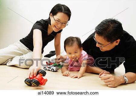 Father, mother and daughter playing with cars View Large Photo Image Stock Photo - Father, mother and daughter playing with cars. Fotosearch