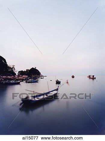Fishing boats at sundown View Large Photo Image Stock Photo - Fishing boats at sundown. Fotosearch