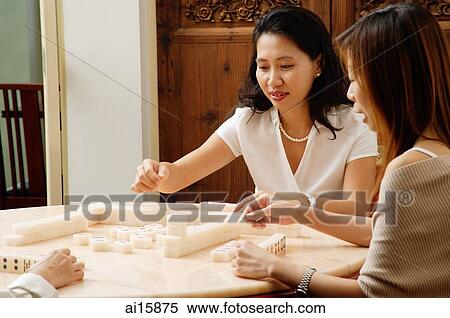 Friends playing mahjong View Large Photo Image Stock Photography - Friends playing mahjong. Fotosearch