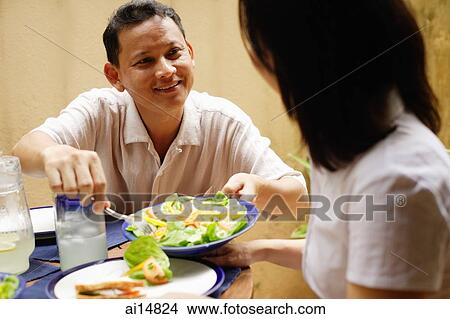 Husband serving wife salad View Large Photo Image Picture - Husband serving wife salad. Fotosearch