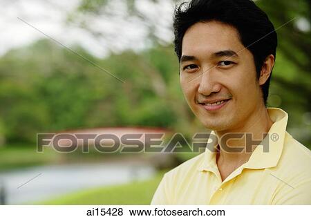 Man looking at camera, smiling View Large Photo Image Stock Photo - Man looking at camera, smiling. Fotosearch