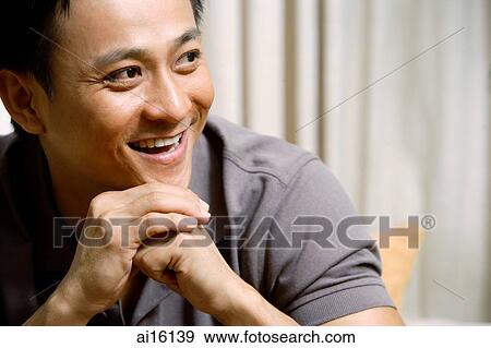 Man looking away, hands clasped, hand on chin View Large Photo Image Stock Photo - Man looking away, hands clasped, hand on chin. Fotosearch
