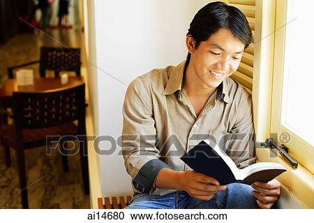 Man reading book, smiling View Large Photo Image Stock Image - Man reading book, smiling. Fotosearch