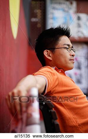 Man sitting, looking away View Large Photo Image Stock Photography - Man sitting, looking away. Fotosearch