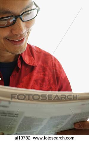 Man with glasses reading newspaper View Large Photo Image Stock Image - Man with glasses reading newspaper. Fotosearch