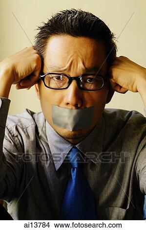 Man with tape over mouth, hand on head View Large Photo Image Picture - Man with tape over mouth, hand on head. Fotosearch