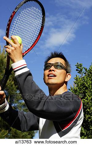 Man with tennis racket and tennis ball View Large Photo Image Stock Image - Man with tennis racket and tennis ball. Fotosearch