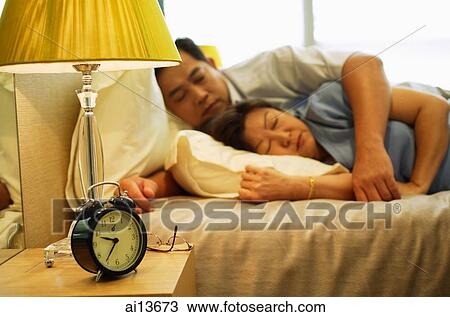 Mature couple sleeping in bedroom View Large Photo Image Stock Image - Mature couple sleeping in bedroom. Fotosearch