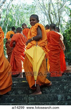 Mihintale temple complex, young Buddhist monks on steps leading to temple, one turning to look at camera View Large Photo Image Stock Photo - Mihintale temple complex, young Buddhist monks on steps leading to temple, one turning to look at camera. Fotosearch