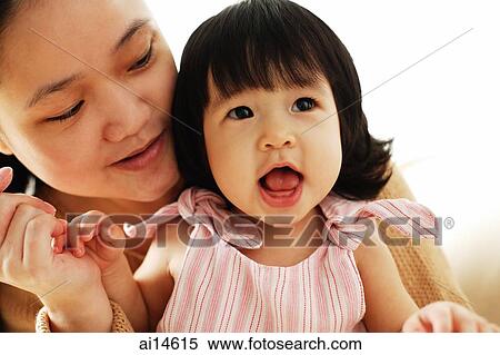 Mother and baby girl, portrait View Large Photo Image Stock Photography - Mother and baby girl, portrait. Fotosearch